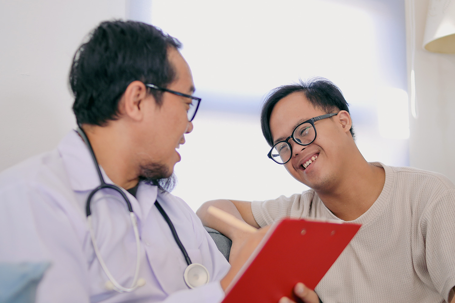 Man talks and Encourages man with Down Syndrome 